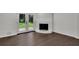 Cozy living room features access to the yard through French doors and hardwood floors at 4340 W Linda Dr, Douglasville, GA 30134