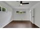 Spacious bedroom with dark laminate flooring, ceiling fan and window at 4340 W Linda Dr, Douglasville, GA 30134