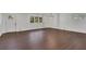 Spacious living room featuring hardwood floors and a modern chandelier at 4340 W Linda Dr, Douglasville, GA 30134