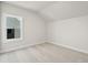 Bright bedroom with carpeted floor and large window at 495 Pearl St, Cumming, GA 30040