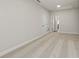 Spacious hallway with carpeted floors and access to other rooms at 495 Pearl St, Cumming, GA 30040