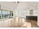 Spacious living room with hardwood floors and sliding glass doors at 495 Pearl St, Cumming, GA 30040