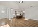 Open living room with hardwood floors and kitchen views at 495 Pearl St, Cumming, GA 30040