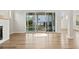 Bright living room with hardwood floors and sliding glass doors leading to backyard at 495 Pearl St, Cumming, GA 30040