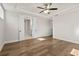 Main bedroom with hardwood floors and access to bathroom at 495 Pearl St, Cumming, GA 30040