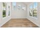 Light-filled office space featuring hardwood floors and large windows at 495 Pearl St, Cumming, GA 30040