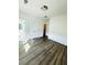 Cozy bedroom with hardwood floors, white walls, closet, and bright natural light at 4440 Sims Park Overlook, Suwanee, GA 30024