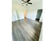 Spacious bedroom with hardwood floors, ceiling fan, closet space, and plenty of natural light at 4440 Sims Park Overlook, Suwanee, GA 30024