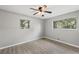Spacious bedroom with wood-look floors and two windows at 1974 Skyview Cir, Douglasville, GA 30135