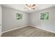Bright bedroom with ceiling fan and wood-look floors at 1974 Skyview Cir, Douglasville, GA 30135