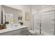 Bright bathroom with a glass-enclosed shower, modern fixtures, and a sleek vanity at 570 Silver Moon Dr, Loganville, GA 30052