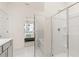 Bathroom showcasing a shower with glass door and partial view of Primary bedroom at 570 Silver Moon Dr, Loganville, GA 30052