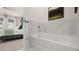 Bathroom with view of a Primary bedroom; features white marble tile and modern finishes at 570 Silver Moon Dr, Loganville, GA 30052