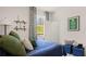 Well-lit bedroom with blue bedding, decorative shelves and soccer decor at 570 Silver Moon Dr, Loganville, GA 30052