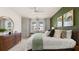 Bright bedroom featuring a cozy bed, soft carpet, dresser and windows with natural light at 570 Silver Moon Dr, Loganville, GA 30052