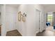 Hallway featuring wood flooring, neutral paint, and convenient access to rooms at 570 Silver Moon Dr, Loganville, GA 30052