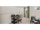 The home office area includes a desk, stylish chair, and plenty of natural light with a view of the outdoors at 570 Silver Moon Dr, Loganville, GA 30052