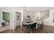 Modern kitchen next to dining area, with stainless steel appliances and ample storage space at 570 Silver Moon Dr, Loganville, GA 30052