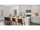 Well-appointed kitchen with stainless steel appliances, quartz countertops, and a stylish breakfast bar at 570 Silver Moon Dr, Loganville, GA 30052