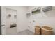 Functional laundry room featuring ample shelving and a modern aesthetic at 570 Silver Moon Dr, Loganville, GA 30052