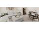 Spacious living room featuring a large sectional sofa, decorative wall art, and adjacent home office at 570 Silver Moon Dr, Loganville, GA 30052