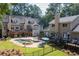 Expansive backyard featuring a swimming pool, spa, multiple decks, and ample seating areas at 2010 Stonehedge Rd, Roswell, GA 30075