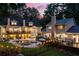 Aerial view of an expansive backyard showcasing a pool, decks, seating areas, and lush landscaping, perfect for outdoor living at 2010 Stonehedge Rd, Roswell, GA 30075