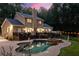 Stunning backyard showcasing a beautiful pool, deck, and landscaped yard perfect for outdoor entertaining at 2010 Stonehedge Rd, Roswell, GA 30075