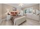 Cozy bedroom features a ceiling fan, neutral paint, and wood flooring at 2010 Stonehedge Rd, Roswell, GA 30075