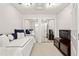 Bedroom with mirrored closet doors, daybed, and media center at 2010 Stonehedge Rd, Roswell, GA 30075