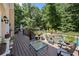 Charming outdoor deck area adorned with potted plants, offering a serene spot for relaxation and enjoying the surrounding nature at 2010 Stonehedge Rd, Roswell, GA 30075