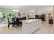 Open-concept dining area, with stainless appliances, access to the backyard, and fireplace at 2010 Stonehedge Rd, Roswell, GA 30075