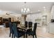 Spacious dining area features modern lighting, and an open-concept layout at 2010 Stonehedge Rd, Roswell, GA 30075