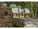 Charming home with stone accents and a beautifully landscaped yard, offering curb appeal and privacy at 2010 Stonehedge Rd, Roswell, GA 30075
