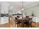 Open kitchen area with a breakfast table, white cabinets and stainless steel appliances at 2010 Stonehedge Rd, Roswell, GA 30075