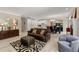 Open-concept living room with hardwood floors and a modern ceiling fixture at 2010 Stonehedge Rd, Roswell, GA 30075