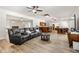 Spacious living room with bar, pool table, hardwood floors, and comfortable leather seating at 2010 Stonehedge Rd, Roswell, GA 30075