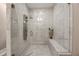 Luxurious marble shower with dual shower heads and built-in seating at 2010 Stonehedge Rd, Roswell, GA 30075