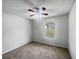 Empty bedroom with wall to wall carpet, ceiling fan and a window at 3384 Brookside Ln, Jonesboro, GA 30236