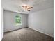 Bedroom featuring carpet, a ceiling fan, and a window offering natural light at 3384 Brookside Ln, Jonesboro, GA 30236