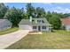 Beautiful one-story home featuring a front-facing garage, porch, and neat landscaping at 3384 Brookside Ln, Jonesboro, GA 30236