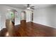 Open-concept living area with hardwood floors connecting the kitchen and dining spaces at 3384 Brookside Ln, Jonesboro, GA 30236