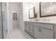 Bright bathroom with double vanity, updated fixtures, and a glass-enclosed shower at 630 Skytop Dr # 157, Cumming, GA 30040