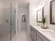 Sleek bathroom features glass shower, double vanity, and modern fixtures at 630 Skytop Dr # 157, Cumming, GA 30040