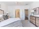 Bedroom boasts soft carpeting, neutral color scheme, and an ensuite bathroom and closet at 630 Skytop Dr # 157, Cumming, GA 30040
