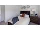 Cozy bedroom with queen bed, accent pillows, and simple bedside decor at 630 Skytop Dr # 157, Cumming, GA 30040
