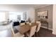 Dining room with modern furniture, art, and a view into the living room at 630 Skytop Dr # 157, Cumming, GA 30040