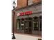 The Club @ Tin Cup Grill exterior with brick facade, dark gray trim and brick-paved sidewalk at 630 Skytop Dr # 157, Cumming, GA 30040