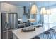 Contemporary kitchen featuring an island, stainless steel appliances, and pendant lighting at 630 Skytop Dr # 157, Cumming, GA 30040