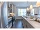 Contemporary kitchen with stainless steel appliances, an island, and access to natural light at 630 Skytop Dr # 157, Cumming, GA 30040